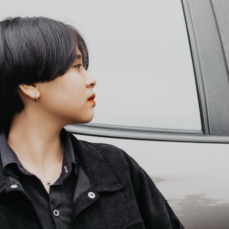 Alex Carter, Lead Design Curator at Quiet Route Craft, reviewing corporate floral arrangements